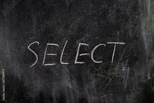 Select inscription on a black chalk board, training courses for working with SQL databases