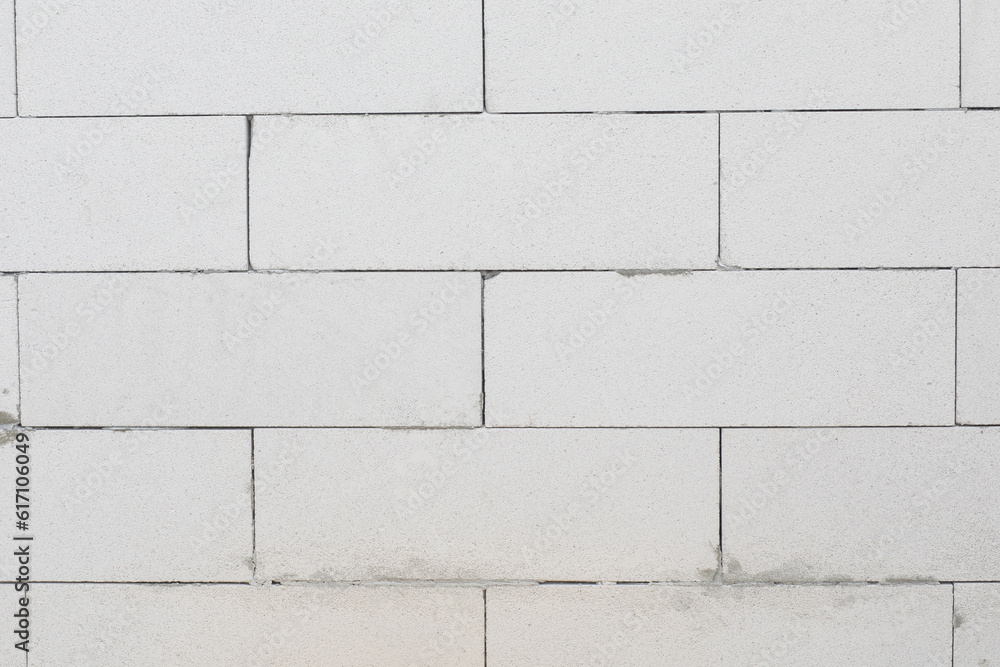 Naklejka premium Wall and gas block masonry thinly with joint glue.