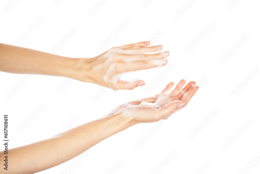 Woman thoroughly washing her hands isolated on white background. Soap foam on female hands.