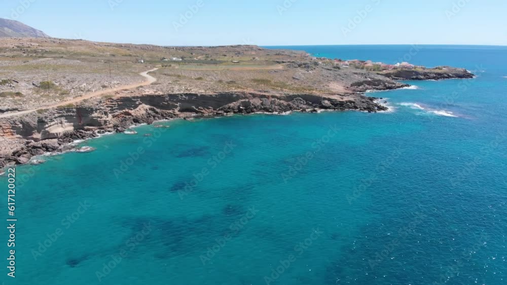 Aerial beautiful beach and water bay in the greek spectacular coast line. Turquoise blue transparent water, unique rocky cliffs, Greece summer top travel destination Peloponnese Aerial beautiful beach and water bay in the greek spectacular coast line. Turquoise blue transparent water, unique rocky cliffs, Greece summer top travel destination Peloponnese