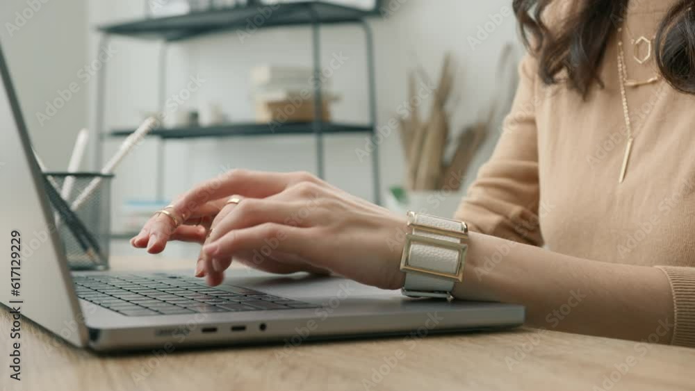 Side view professional user worker using notebook. Close up technology concept 4K. Female hands of business woman typing on laptop keyboard sit at home office desk working online with pc software apps Side view professional user worker using notebook. Close up technology concept 4K. Female hands of business woman typing on laptop keyboard sit at home office desk working online with pc software apps