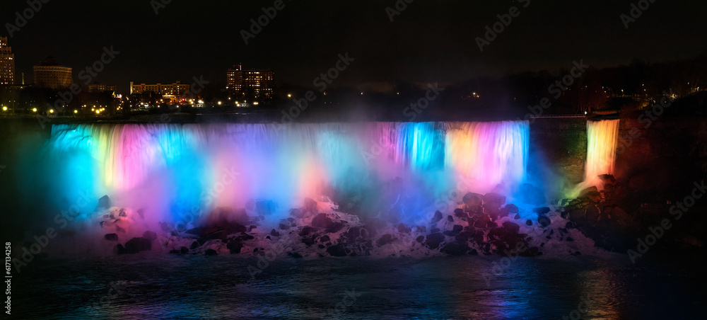 Niagara Falls, A Kaleidoscope of Diversity: Captivating Niagara Falls at Night, Adorned in Mesmerizing Rainbow Hues.  Landscape Photography.