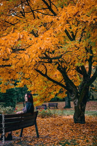 girl sitting on a park bench
