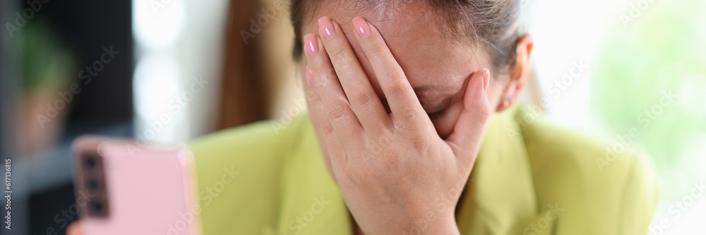 Frustrated depressed woman covering face with hand
