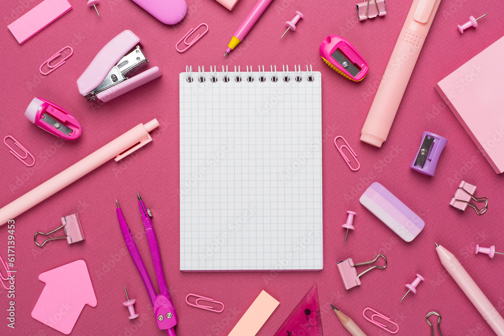 Pink school stationery with notebook on color backgroung, top view Pink school stationery with notebook on color backgroung, top view