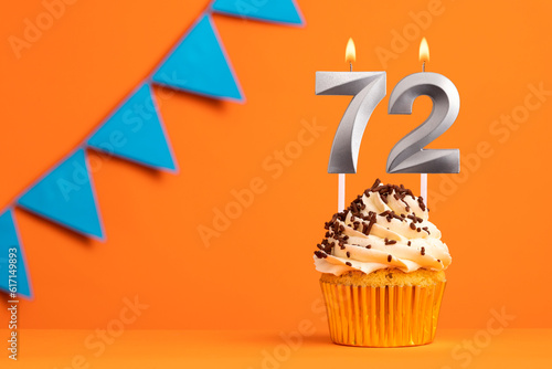 Candle number 72 - Cake birthday in orange background
