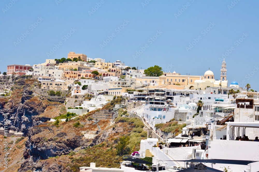 White and neutral buildings on top cliff in Fira, Santorini 