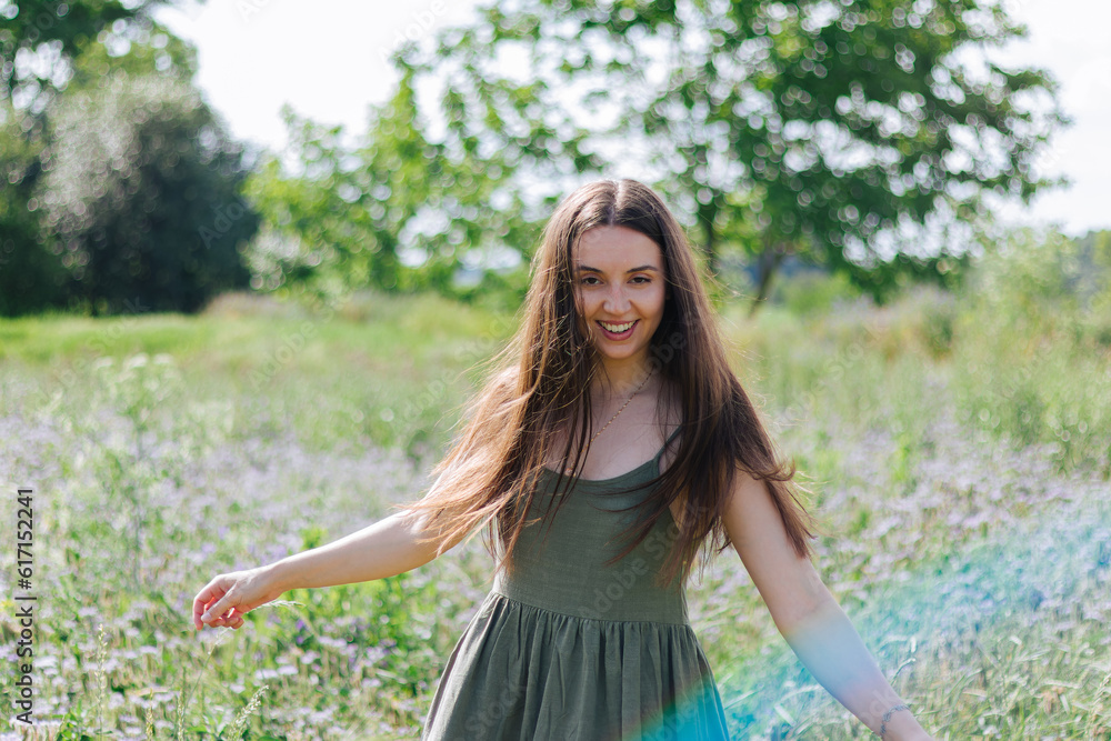 Fototapeta premium girl with long hair.woman's mental health.calm peaceful dreamy girl.woman dreams and thinks.feeling of relaxation.self-confidence. Sad woman.cheerful woman outdoors.relaxed girl. walking in the meadow