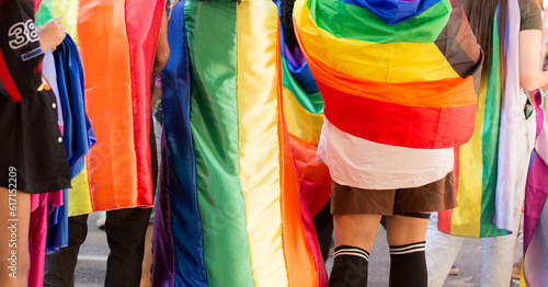 Pessoas vestindo a bandeira símbolo do orgulho gay lgbt+. 27ª edição, da Parada do Orgulho LGBT+ de São Paulo, Brasil.  photo