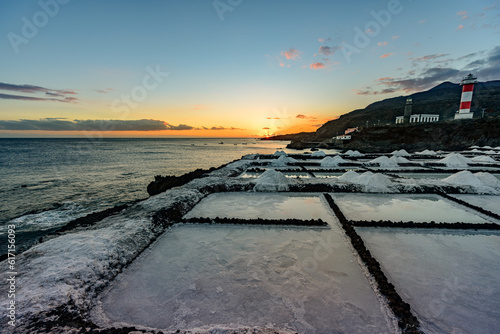Sunset at the salt flats directly on the Atlantic coast. The sea salt shines romantically in the light