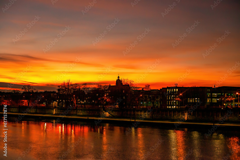 Colorful bright sunset over Vistula river in Krakow, Poland