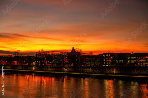 Colorful bright sunset over Vistula river in Krakow, Poland