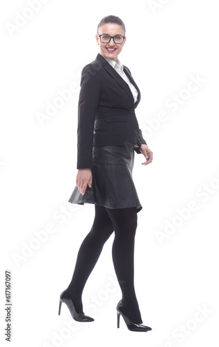 in full growth. smiling businesswoman confidently striding forward