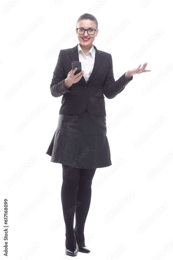 in full growth. smiling businesswoman reading a message on her smartphone. in full growth. smiling businesswoman reading a message on her smartphone.