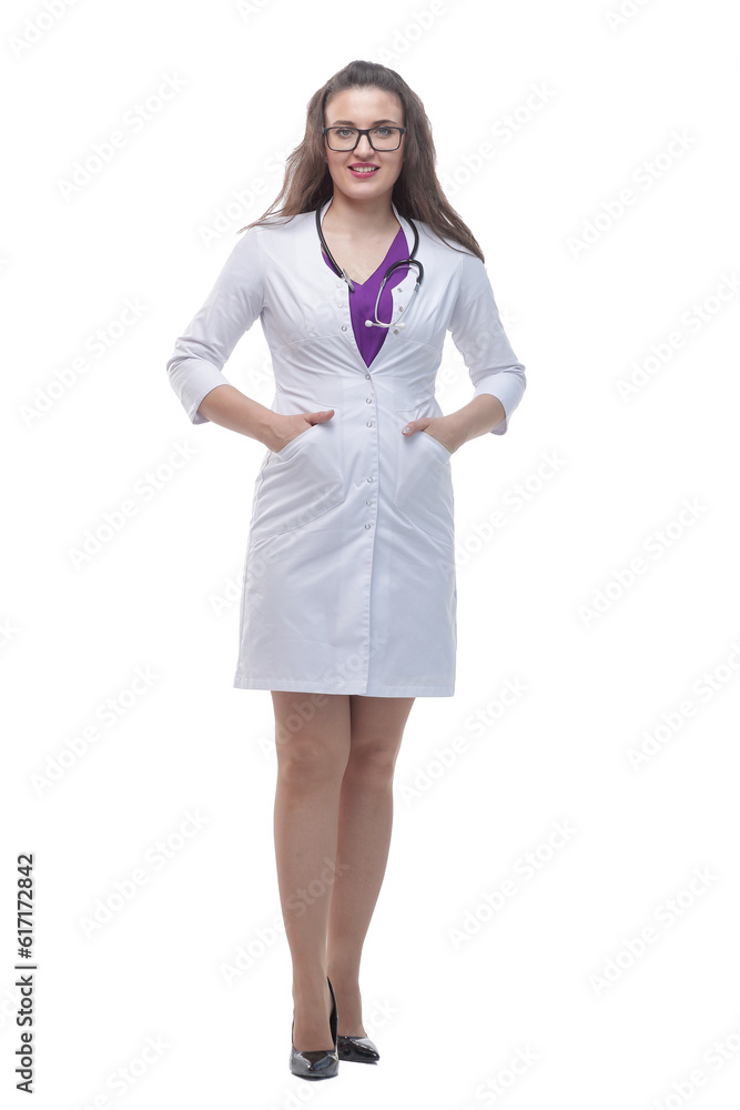 in full growth. a young woman doctor with a stethoscope in full growth. a young woman doctor with a stethoscope