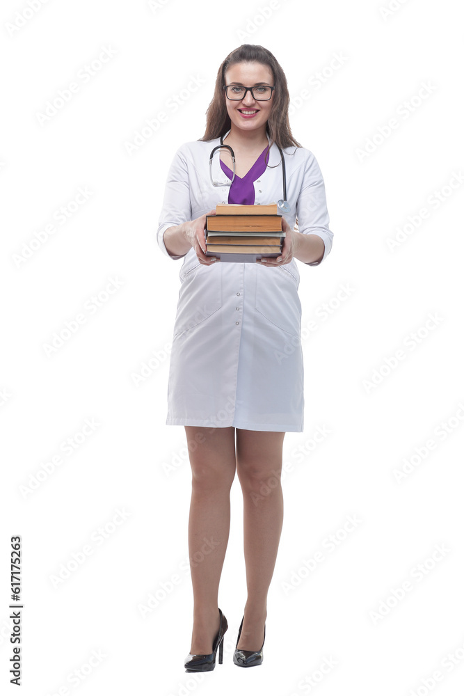 in full growth. a stack of books in the hands of a young doctor. in full growth. a stack of books in the hands of a young doctor.
