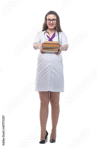 in full growth. a stack of books in the hands of a young doctor.