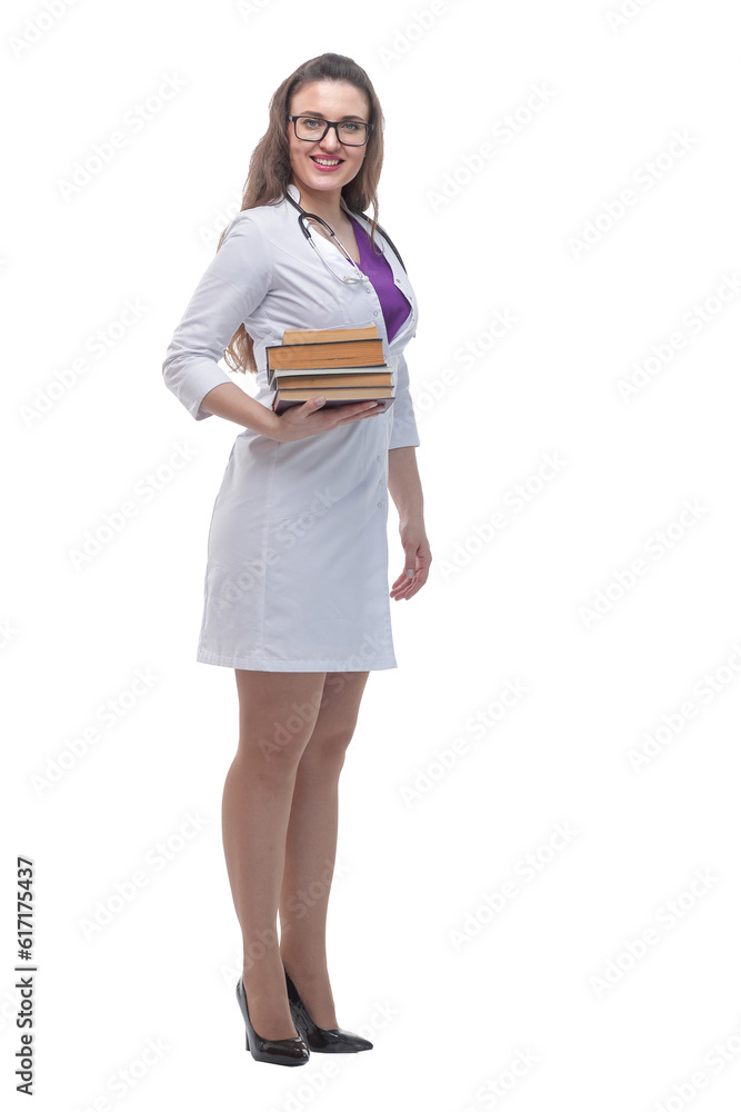 in full growth. a stack of books in the hands of a young doctor. in full growth. a stack of books in the hands of a young doctor.