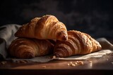Board with delicious croissants on a dark wooden table, close-up. french pastries.generative AI