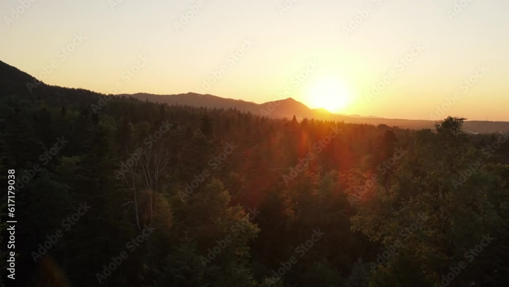 Aerial drone view of epic and inspiring landscape of high mountains during amazing sunset or twilight with beautiful sunlight leaks and beams entering frame. Mesmerizing and seeing nature concept Aerial drone view of epic and inspiring landscape of high mountains during amazing sunset or twilight with beautiful sunlight leaks and beams entering frame. Mesmerizing and seeing nature concept