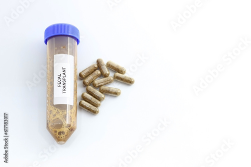 Pills or medicines with fecal microbiota to cure persistent digestive diseases such as infection by Clostridium bacteria. Fecal transplant. Space for text photo