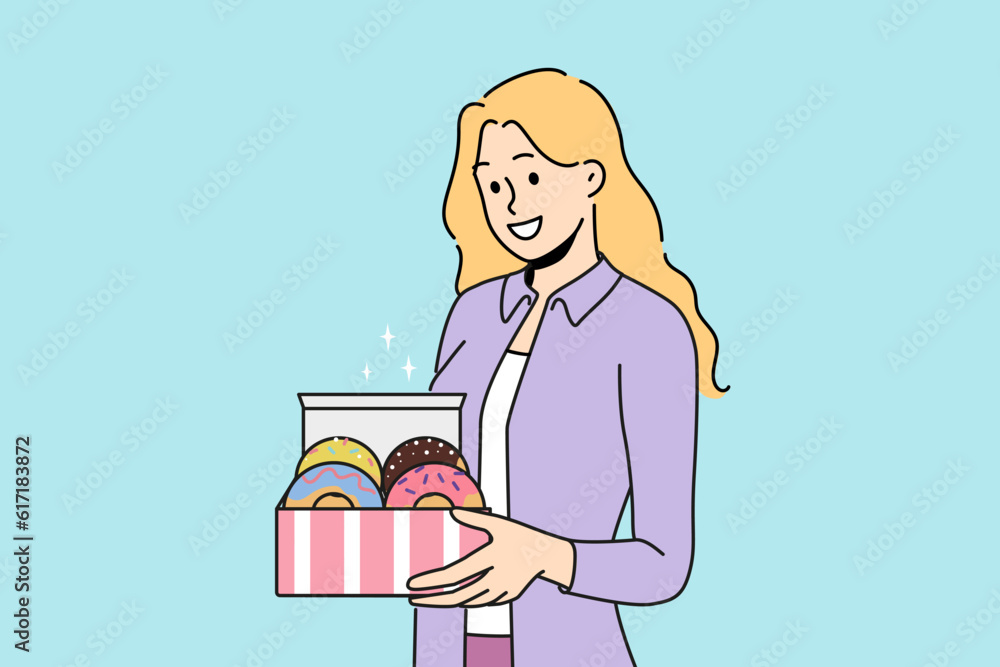 Woman holds donuts in box offering breakfast with sweet pastries with fruit or chocolate icing. Happy girl with donuts for kids party with desserts delivered from patisserie or bought in coffee shop Woman holds donuts in box offering breakfast with sweet pastries with fruit or chocolate icing. Happy girl with donuts for kids party with desserts delivered from patisserie or bought in coffee shop