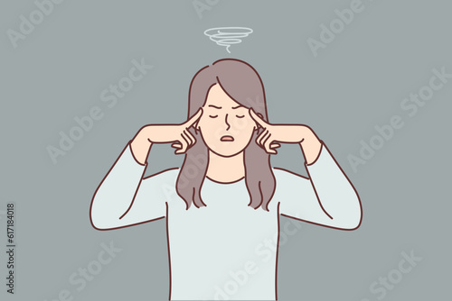 Woman suffers from dizziness and migraine caused by regular stress or lack of rest from work