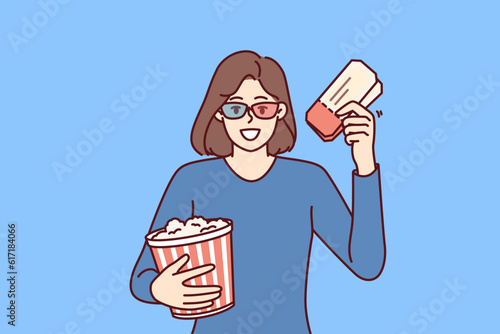Woman with popcorn and tickets for cinema invites to visit interesting new blockbuster this weekend. Happy girl in 3d cinema glasses rejoice at opportunity to watch new film with special effects