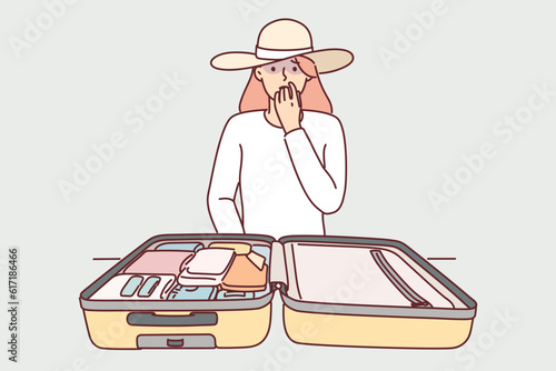 Woman tourist with travel suitcase is worried about losing personal belongings or stealing money