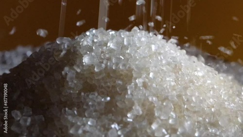 Sugar crystals close up falling