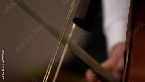 Close up of person playing the cello bass