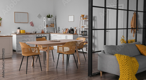 Modern studio apartment interior with kitchen and sofa