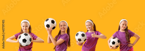 Sporty little girl with soccer ball on yellow background