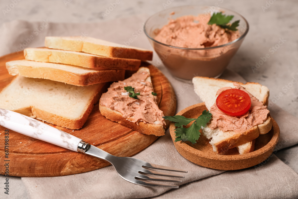 Plate of tasty sandwiches with pate on grunge background, closeup