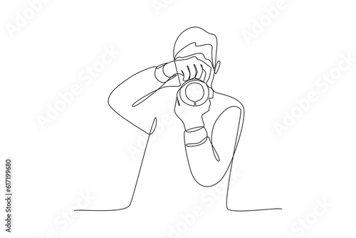 Single one line drawing  Photographer with camera. World photography day concept. Continuous line draw design graphic vector illustration.
