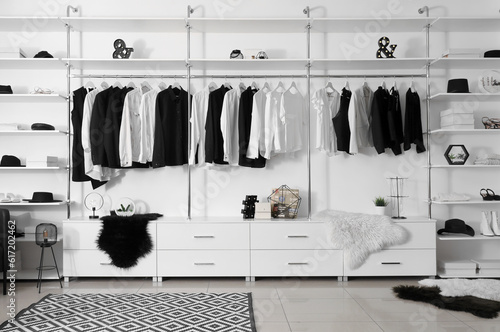 Wallpaper Mural Stylish clothes with shoes and accessories in modern boutique Torontodigital.ca