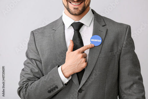 Male volunteer pointing at ...