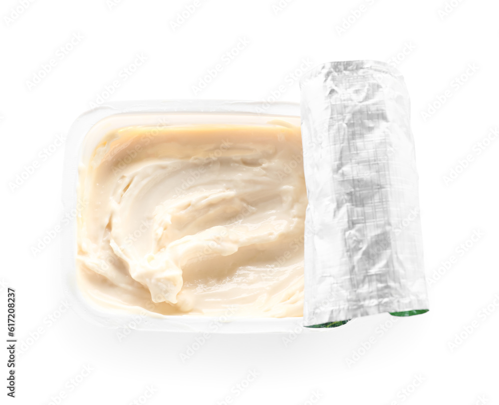 Plastic container with tasty cream cheese on white background