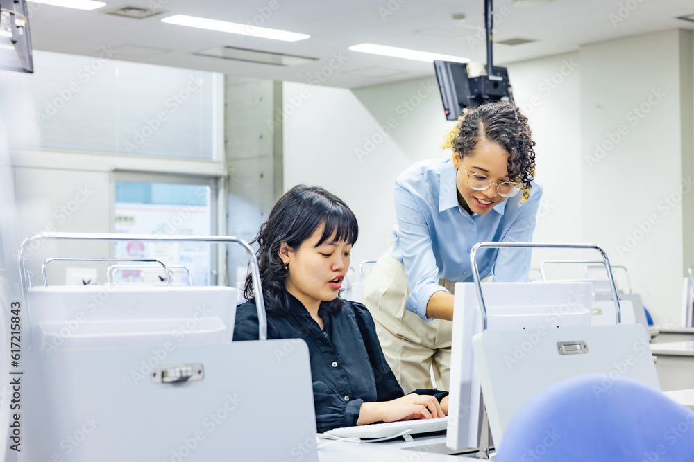 Multinational group having a conversation in the office. International school. Global business. Multinational group having a conversation in the office. International school. Global business.