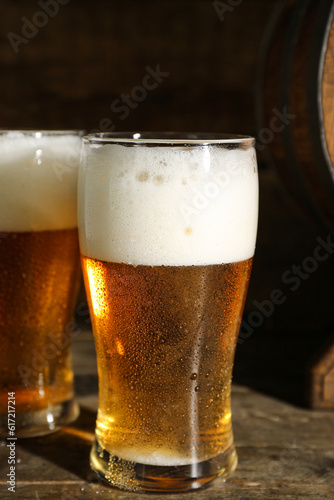 Glasses of cold beer on wooden background, closeup