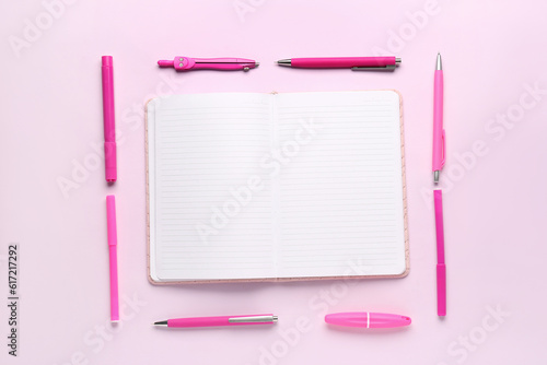 Open lined notebook with pi...