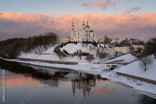 Assumption Mountain, the Holy Spirit Monastery and the Holy Assumption Cathedral on the banks of the Western Dvina and Vitba rivers on a sunny winter evebibg, Vitebsk, Belarus