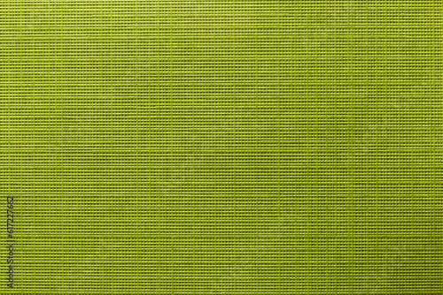 Green color eco recycled kraft paper sheet texture cardboard background.