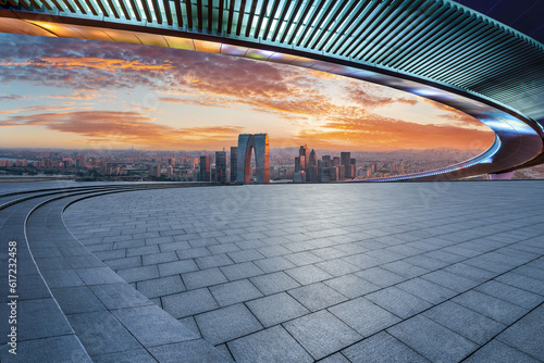 Empty square floors and city skyline with modern buildings at sunset in Suzhou, Jiangsu Province, China. high angle view.