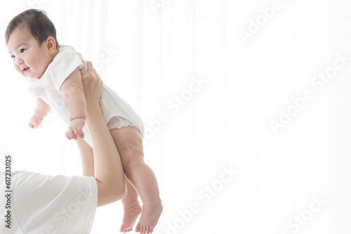 Baby doing lift up in backlight. Photocopying space 