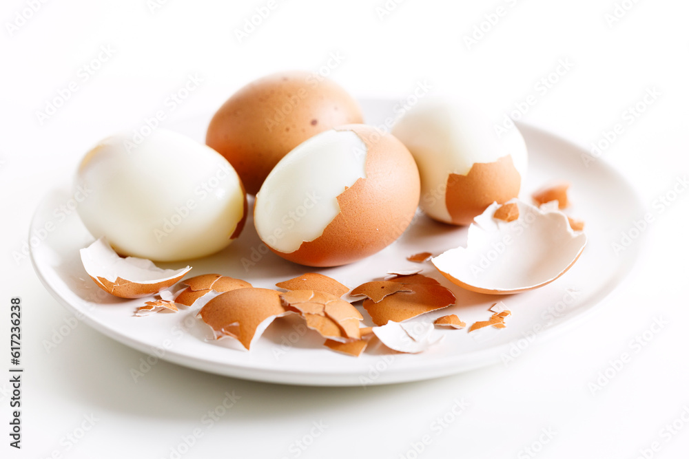 Boiled eggs with brown shall on white plate. Boiled eggs with brown shall on white plate.