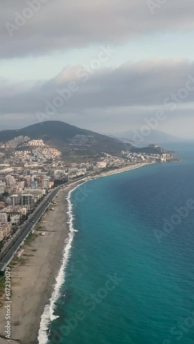Vertical Video: Aerial Reflections - Winter Cityscape on the Mediterranean Coast photo