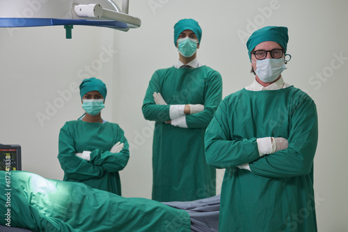 Professional doctors team, specialist surgeons in uniforms, White professors, and assistants wear operating face masks, surgery on critically ill patients in hospital's ICU, and paramedic occupation.