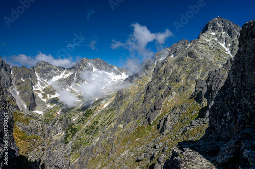 An outstanding mountain landscape of the High Tatras. A view from the Lomnicka Pass on the Little Cold Valley and the Lomnicky Stit (Lomnicky Peak), Slovakia.