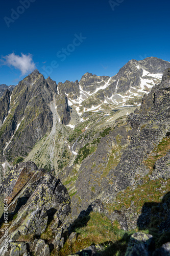 An outstanding mountain landscape of the High Tatras. A view from the Lomnicka Pass to the Little Cold Valley. Mala Studena Dolina, Slovakia. photo